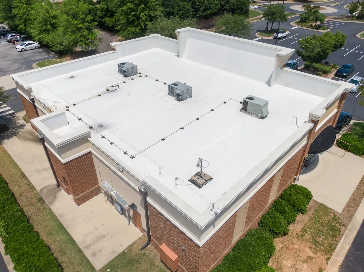 Aerial view of a flat commercial roof system on a Texas office building