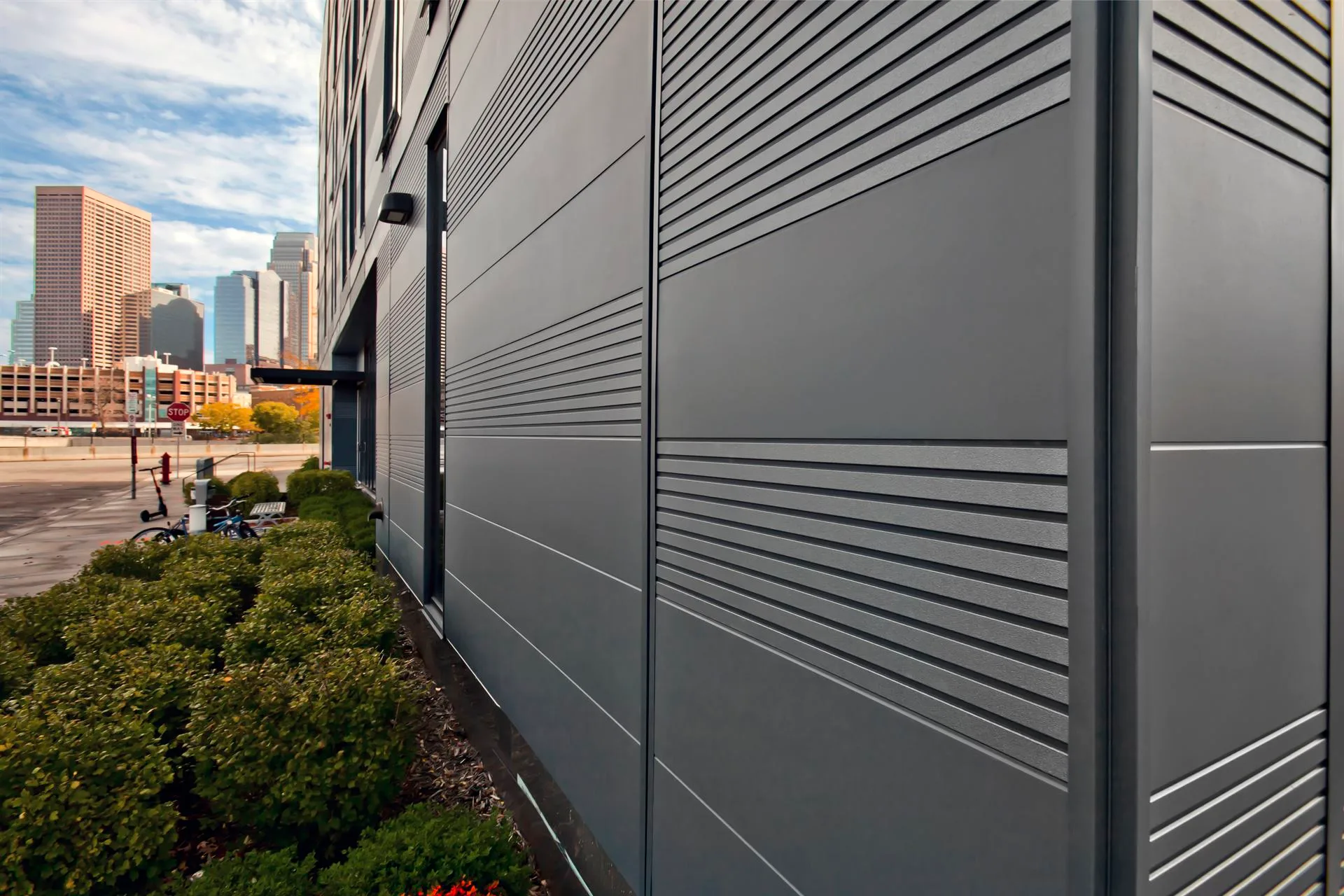 Metal panel cladding and railing detail on a commercial property exterior